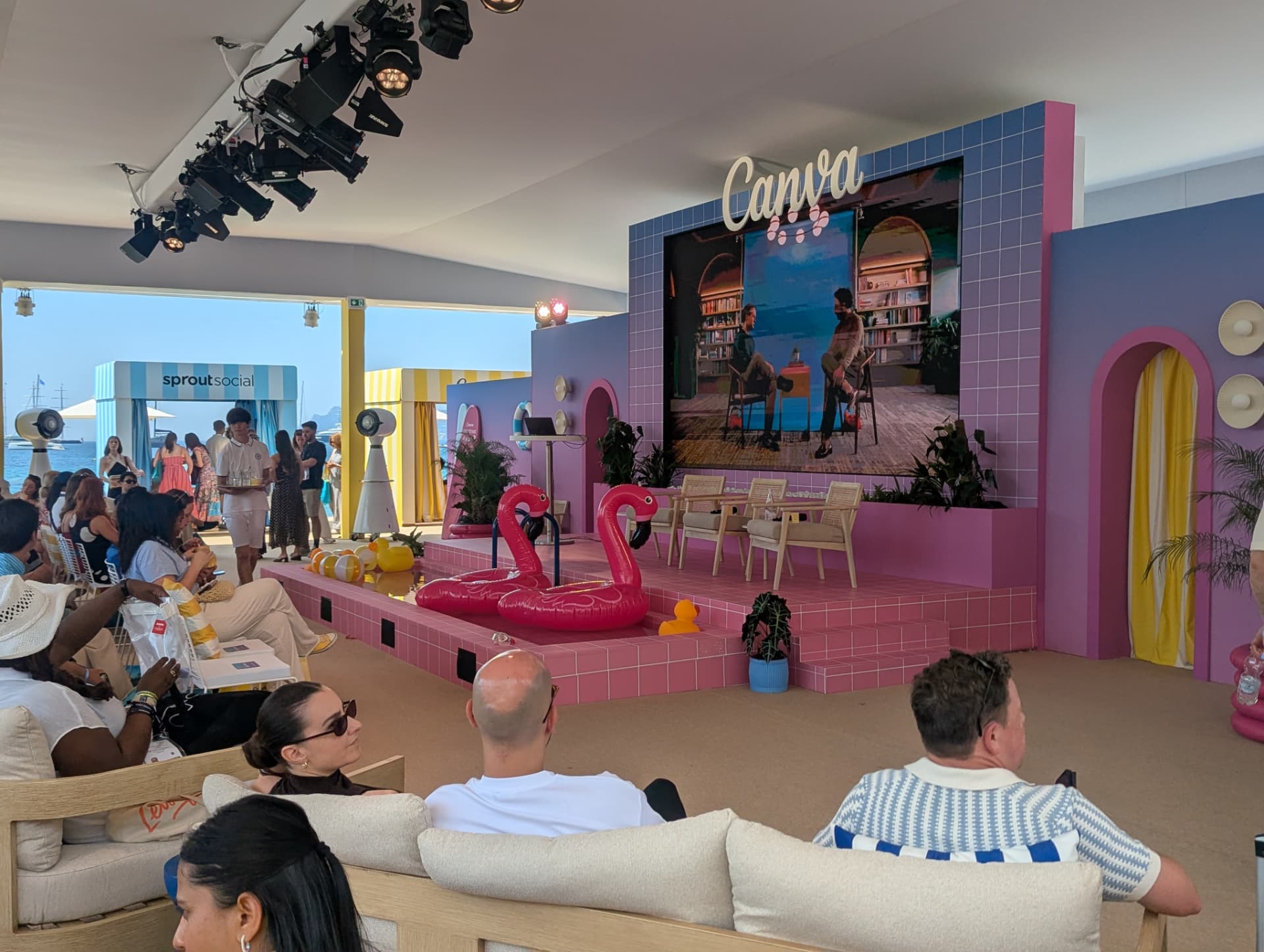 Attendees watching a session at a Canva beach event
